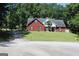 Charming brick home with well-manicured lawn and mature trees offering a serene suburban setting at 25 Castlehill Ct, Covington, GA 30016