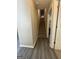 Hallway with staircase offers access to upper and lower levels of the home at 25 Castlehill Ct, Covington, GA 30016