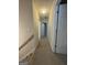 Hallway with carpeted floors provides access to various rooms in the house at 25 Castlehill Ct, Covington, GA 30016