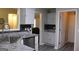 Bright kitchen with stainless steel sink, modern appliances, granite counters, and ample storage space at 25 Castlehill Ct, Covington, GA 30016