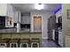 Eat in kitchen featuring granite countertops, stainless steel appliances, and bar stool seating at 25 Castlehill Ct, Covington, GA 30016
