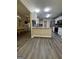 An open kitchen and breakfast bar offers views into the adjacent dining area at 25 Castlehill Ct, Covington, GA 30016