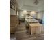 Cozy main bedroom with elegant decor, soft lighting, and a plush upholstered bench at 25 Castlehill Ct, Covington, GA 30016