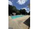 Beautiful community pool with lounge chairs and a fountain feature for residents enjoyment at 25 Castlehill Ct, Covington, GA 30016