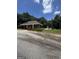 Community pool with a fenced in area, plants and shade provided by mature trees at 25 Castlehill Ct, Covington, GA 30016