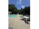 A lovely pool with table seating surrounding for enjoying the warm weather and a cool drink at 25 Castlehill Ct, Covington, GA 30016