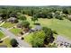 Aerial view of the golf course community and lush green lawns at 411 Hickory Fairway Ct, Woodstock, GA 30188