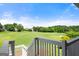 View of the golf course and backyard area as seen from upper deck at 411 Hickory Fairway Ct, Woodstock, GA 30188