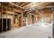 Unfinished basement area with exposed framing and ample storage space at 411 Hickory Fairway Ct, Woodstock, GA 30188