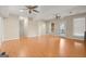 Open basement offers a large living area with hardwood floors, a staircase, and natural light at 411 Hickory Fairway Ct, Woodstock, GA 30188