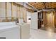 Unfinished basement laundry area with appliances and open layout at 411 Hickory Fairway Ct, Woodstock, GA 30188
