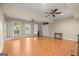 Spacious basement with hardwood floors, ceiling fans, and ample lighting, perfect for versatile living at 411 Hickory Fairway Ct, Woodstock, GA 30188