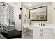 Spa-like bathroom with a glass shower, tiled walls, and a modern vanity at 411 Hickory Fairway Ct, Woodstock, GA 30188