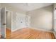 Bright bedroom features a closet and views of the backyard at 411 Hickory Fairway Ct, Woodstock, GA 30188