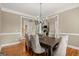 Formal dining room with hardwood floors and an open layout at 411 Hickory Fairway Ct, Woodstock, GA 30188