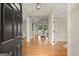 Inviting foyer with hardwood floors, high ceilings, and arched doorways at 411 Hickory Fairway Ct, Woodstock, GA 30188