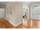 Elegant entryway featuring hardwood floors and detailed trim work at 411 Hickory Fairway Ct, Woodstock, GA 30188