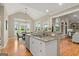Open kitchen with granite countertops, stainless steel appliances, and a breakfast nook at 411 Hickory Fairway Ct, Woodstock, GA 30188