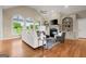 Bright living room featuring vaulted ceilings, built-in shelves, and a fireplace at 411 Hickory Fairway Ct, Woodstock, GA 30188