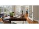 Bright home office with french doors, hardwood floors, and ample natural light at 411 Hickory Fairway Ct, Woodstock, GA 30188