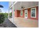 Covered patio space with brick columns, ceiling fan, and access to landscaped yard at 411 Hickory Fairway Ct, Woodstock, GA 30188