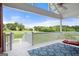 Enclosed patio with patterned rug and view of the backyard at 411 Hickory Fairway Ct, Woodstock, GA 30188