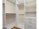 Walk-in closet features custom shelving and ample storage at 411 Hickory Fairway Ct, Woodstock, GA 30188