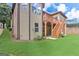 Inviting backyard featuring a wooden deck with stairs leading to a well-manicured lawn and neutral colored siding at 4924 Locklear Way, Marietta, GA 30066