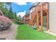 Backyard and wood stairs from upper deck, landscaping, and green grass at 4924 Locklear Way, Marietta, GA 30066