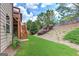 Home backyard featuring lush green grass, landscaping, and backyard stairs at 4924 Locklear Way, Marietta, GA 30066