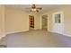 Finished basement room with ceiling fan and access to storage and other areas at 4924 Locklear Way, Marietta, GA 30066