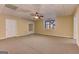 Expansive finished basement with neutral paint, carpeted floors and drop ceiling at 4924 Locklear Way, Marietta, GA 30066
