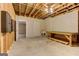 Unfinished basement with exposed ceiling, unfinished walls, workbench, and utility sink at 4924 Locklear Way, Marietta, GA 30066