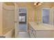 Well-lit bathroom with a white countertop, cabinets, and tiled floor at 4924 Locklear Way, Marietta, GA 30066