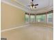 Bright main bedroom featuring tray ceilings, carpet floors, and large windows at 4924 Locklear Way, Marietta, GA 30066