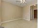 Bright bedroom featuring neutral walls, carpet, ceiling fan, and trim details at 4924 Locklear Way, Marietta, GA 30066