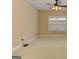Neutral bedroom featuring a ceiling fan and large double window at 4924 Locklear Way, Marietta, GA 30066