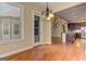 An open dining area adjacent to the kitchen with a door to the deck and staircase at 4924 Locklear Way, Marietta, GA 30066