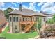 Back of the home features an upper deck with stairs to the yard and backyard at 4924 Locklear Way, Marietta, GA 30066