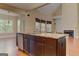 An open kitchen with wooden cabinets, granite countertops, a dishwasher, and stainless steel sink at 4924 Locklear Way, Marietta, GA 30066