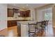 Kitchen with granite countertops, stainless steel appliances, dark wood cabinets, and an adjacent breakfast area at 4924 Locklear Way, Marietta, GA 30066