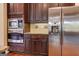 Gourmet kitchen featuring stainless steel appliances, custom cabinets, and modern backsplash at 4924 Locklear Way, Marietta, GA 30066