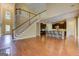 Open floor plan featuring a kitchen with stainless steel appliances, dark wood cabinets, and a breakfast bar at 4924 Locklear Way, Marietta, GA 30066