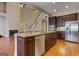 Kitchen with stainless steel appliances, granite countertops, dark wood cabinets, and a breakfast bar at 4924 Locklear Way, Marietta, GA 30066