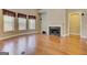 Spacious living room with hardwood floors, fireplace, lots of natural light, and archway to another room at 4924 Locklear Way, Marietta, GA 30066