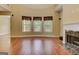 Comfortable living room featuring hardwood floors, lots of natural light, and a fireplace at 4924 Locklear Way, Marietta, GA 30066