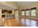 Open-concept living room with wood floors, kitchen view, and lots of natural light at 4924 Locklear Way, Marietta, GA 30066