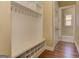 Mudroom featuring hardwood floors, a bench with shoe storage, and coat hooks at 4924 Locklear Way, Marietta, GA 30066