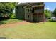 Exterior view of the home showing a well-maintained lawn and multi-level deck at 5418 Amity Dr, Powder Springs, GA 30127