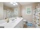 Bright bathroom with a shower/tub, neutral color scheme, and playful animal-themed décor at 5418 Amity Dr, Powder Springs, GA 30127